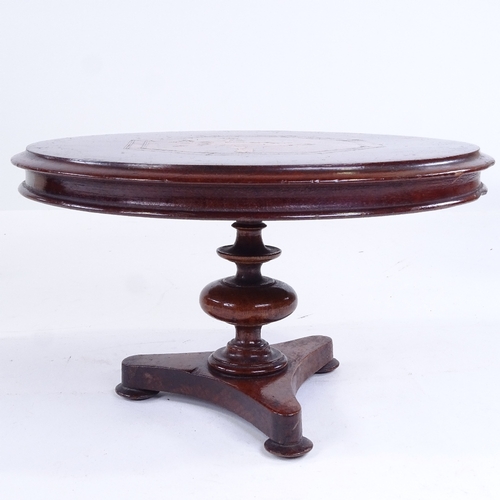 300 - A 19th century mahogany doll's tilt-top dining table, with bird marquetry inlaid top and platform ba... 