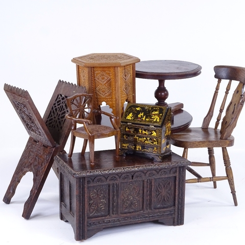 303 - A group of doll's furniture, including a 1930s panelled coffer, width 24cm, 2 tilt-top dining tables... 