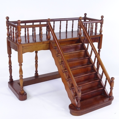 304 - 2 mahogany staircase design display stands, late 20th century, largest width 45cm