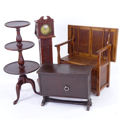 306 - A group of doll's furniture, including oak monk's settle, width 27cm, a miniature longcase clock, a ... 