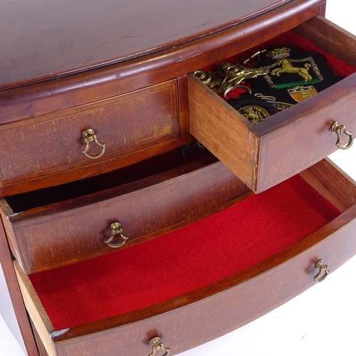 311 - An Edwardian mahogany apprentice bow-front chest of drawers, with brass drop handles, width 37cm, he... 