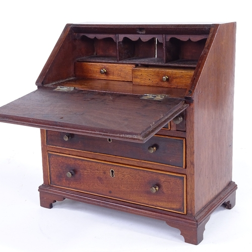 315 - A Victorian mahogany apprentice bureau with 3 drawers under, width 23cm, height 25cm