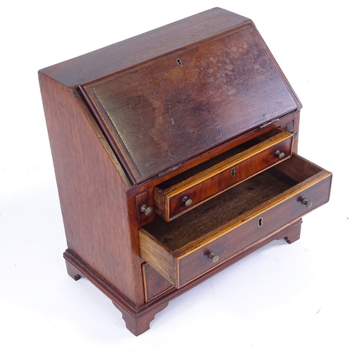 315 - A Victorian mahogany apprentice bureau with 3 drawers under, width 23cm, height 25cm