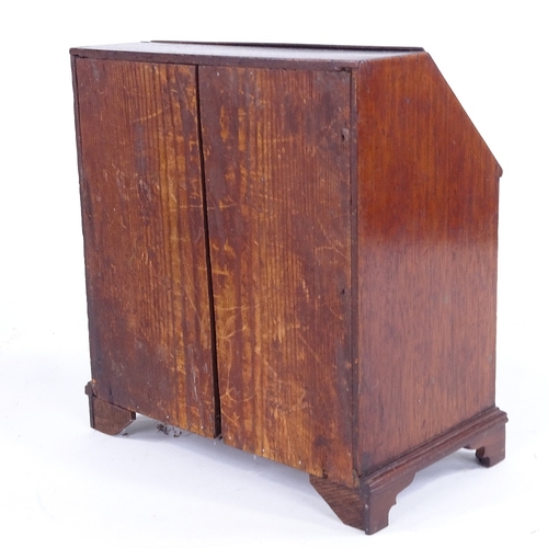 315 - A Victorian mahogany apprentice bureau with 3 drawers under, width 23cm, height 25cm