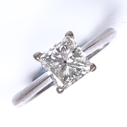 1110 - A 1ct Princess-cut solitaire diamond ring, set in plain 4-claw 18ct white gold settings, colour appr... 