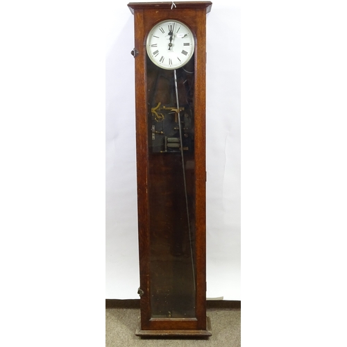 319 - An oak-cased synchronome electric wall clock with glazed door, height 127cm