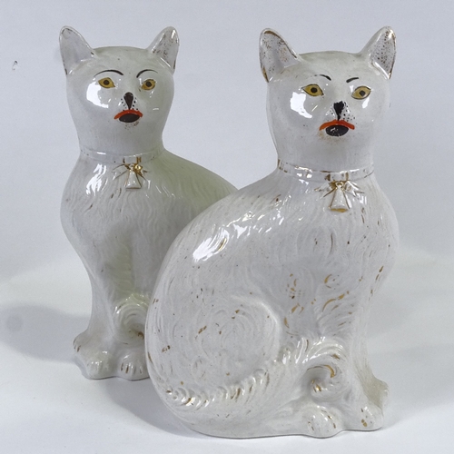 368 - A rare pair of 19th century Staffordshire Pottery seated cats, height 34cm