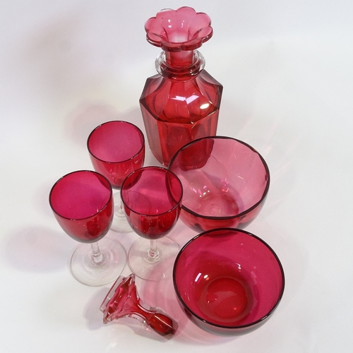 579 - A cranberry glass decanter, two cranberry glass finger bowls and three glasses, decanter height 23cm... 