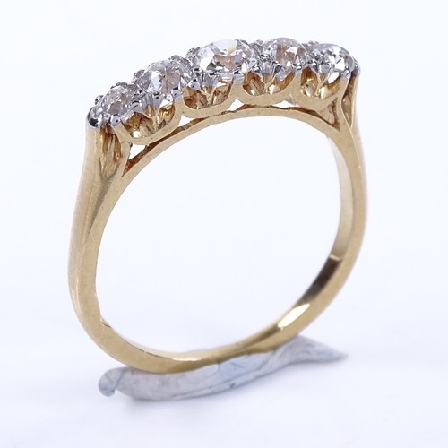 1151 - An early 20th century 18ct gold graduated 5-stone diamond half hoop ring, total diamond content appr... 