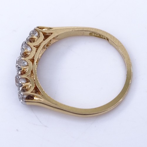 1151 - An early 20th century 18ct gold graduated 5-stone diamond half hoop ring, total diamond content appr... 