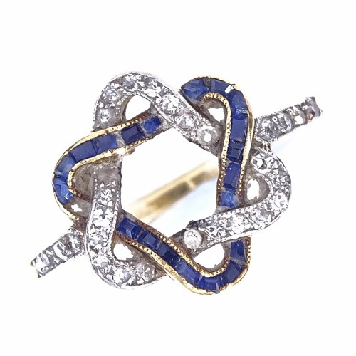 1150 - An early 20th century unmarked high carat gold sapphire and diamond dress ring, inverted intertwined... 