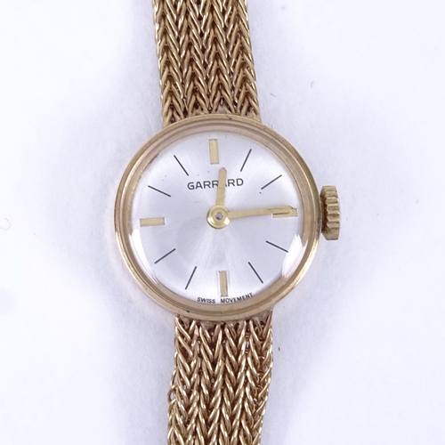 1006 - GARRARD - a lady's Vintage 9ct gold mechanical wristwatch, silvered dial with quarterly gilt baton h... 