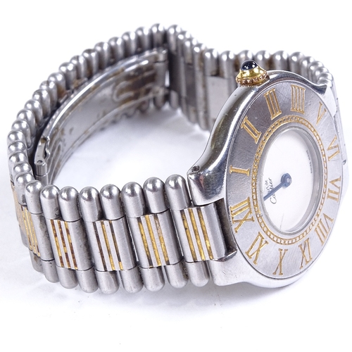 1011 - CARTIER - a lady's stainless steel Must De Cartier quartz wristwatch, silvered dial with blued steel... 