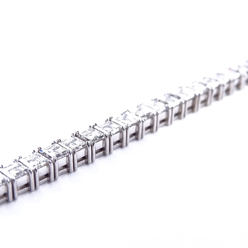 1112 - A baguette diamond tennis line bracelet, circa 1960, total diamond content approx 15ct, set with 50 ... 