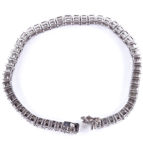 1112 - A baguette diamond tennis line bracelet, circa 1960, total diamond content approx 15ct, set with 50 ... 