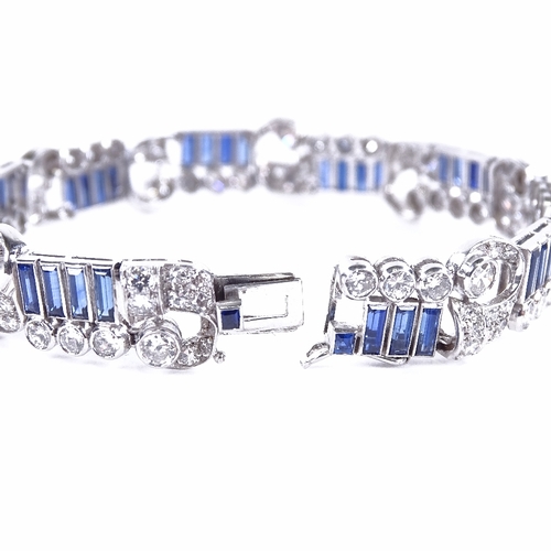 1115 - An Art Deco sapphire and diamond bracelet, circa 1930s, geometric and scroll form, set with rectangu... 