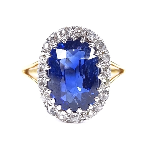 1123 - An oval sapphire and diamond cluster ring, circa 1915, central oval mixed-cut sapphire approx 5.66ct... 