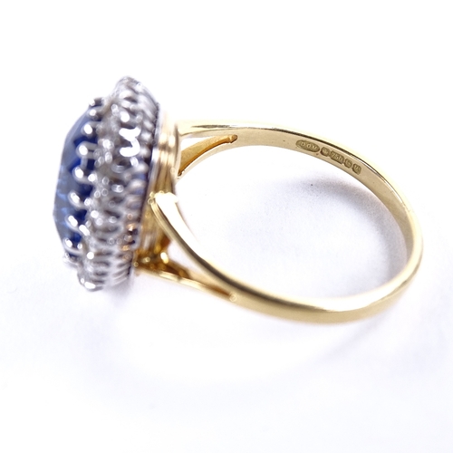 1123 - An oval sapphire and diamond cluster ring, circa 1915, central oval mixed-cut sapphire approx 5.66ct... 