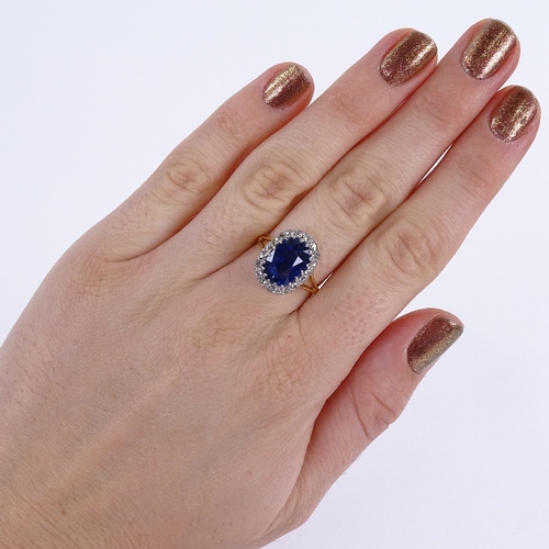 1123 - An oval sapphire and diamond cluster ring, circa 1915, central oval mixed-cut sapphire approx 5.66ct... 