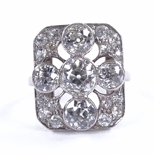 1125 - An Art Deco diamond cluster panel ring, circa 1920, geometric quatrefoil form set with old-cut diamo... 