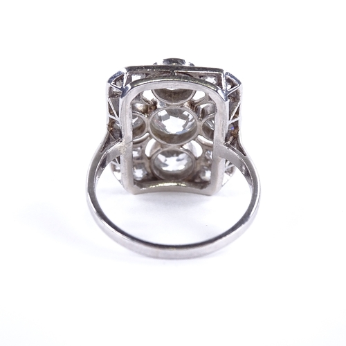 1125 - An Art Deco diamond cluster panel ring, circa 1920, geometric quatrefoil form set with old-cut diamo... 