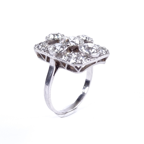 1125 - An Art Deco diamond cluster panel ring, circa 1920, geometric quatrefoil form set with old-cut diamo... 