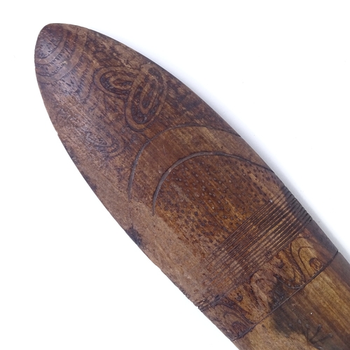 69 - A Tribal hardwood throwing spear/boomerang, with engraved stylised turtle design, probably 20th cent... 