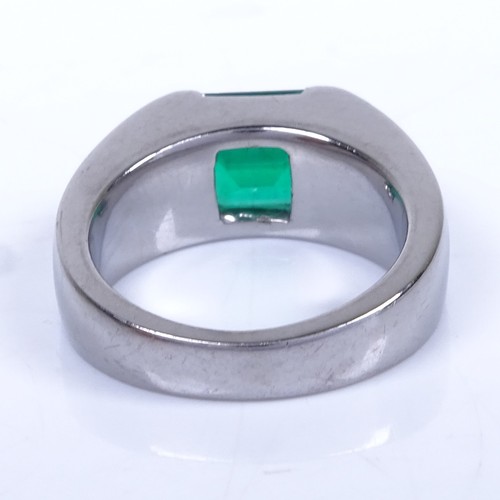 1134 - A Colombian emerald ring, rectangular emerald-cut emerald weighing approx 2.42ct bezel-set in heavy ... 