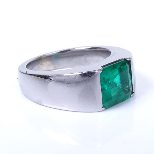 1134 - A Colombian emerald ring, rectangular emerald-cut emerald weighing approx 2.42ct bezel-set in heavy ... 