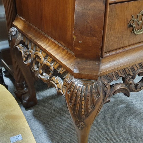 348 - A Continental crossbanded walnut chest of 2 drawers, with shaped top, carved apron and cabriole legs... 