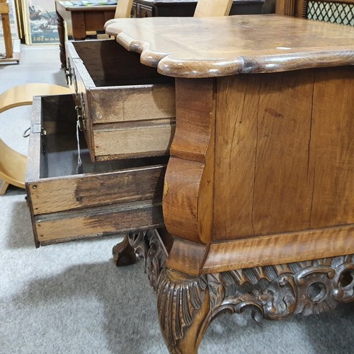 348 - A Continental crossbanded walnut chest of 2 drawers, with shaped top, carved apron and cabriole legs... 