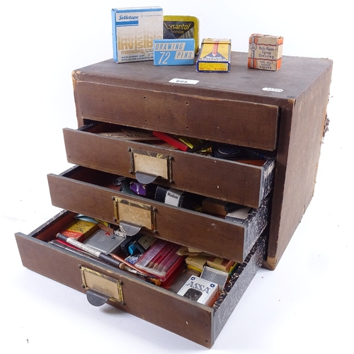 605 - A table-top filing chest of drawers, containing various Vintage rulers, writing instruments etc