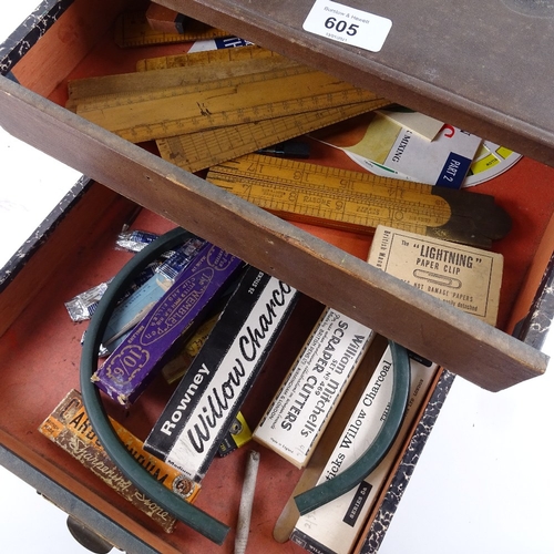 605 - A table-top filing chest of drawers, containing various Vintage rulers, writing instruments etc