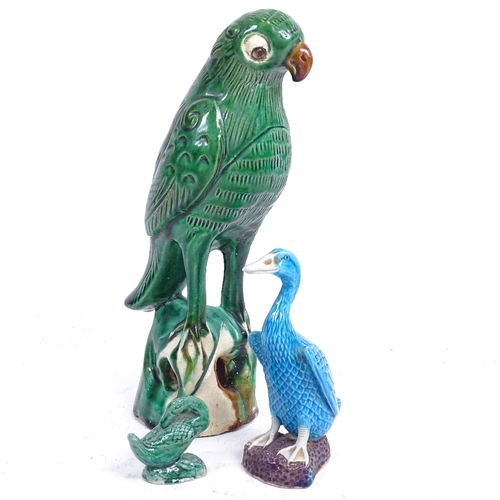 113 - A Chinese green glaze pottery parrot, a turquoise glaze duck, and another, largest height 22cm (3)