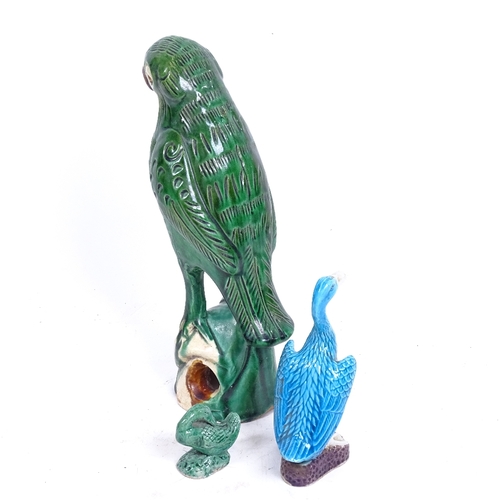 113 - A Chinese green glaze pottery parrot, a turquoise glaze duck, and another, largest height 22cm (3)