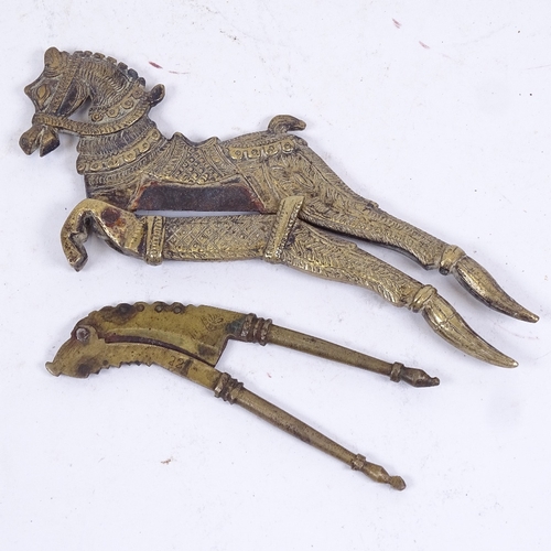 186 - 2 19th century Middle Eastern brass nutcrackers, 1 formed as a prancing horse, length 17cm (2)