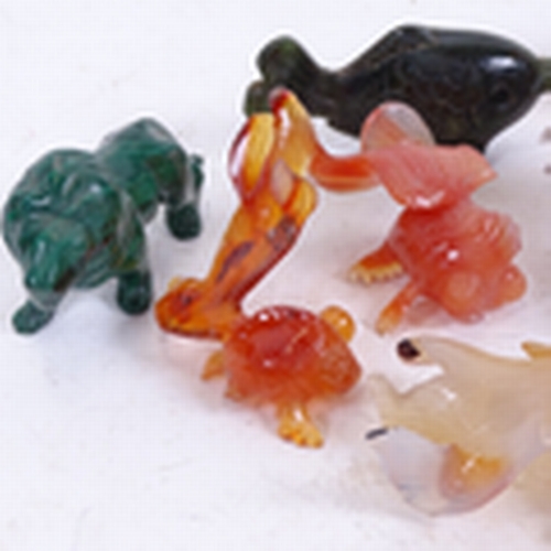 205 - A group of carved and polished hardstone animals, including malachite lion, amethyst and rose quartz... 