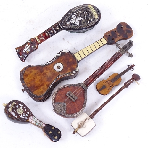 212 - A small group of miniature mother-of-pearl mandolins, guitars and other instruments (6)