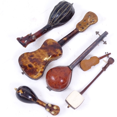 212 - A small group of miniature mother-of-pearl mandolins, guitars and other instruments (6)