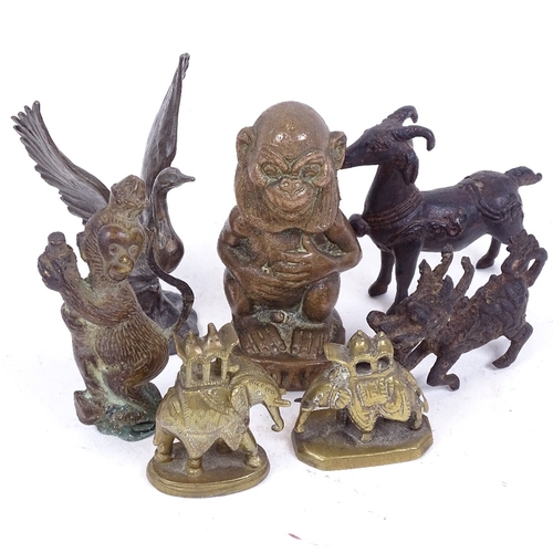 214 - A group of Eastern cast metal figures and animals, largest height 10cm (7)