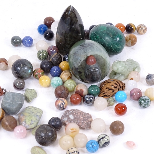 219 - A group of carved and polished hardstone balls, labradorite prism, malachite egg etc (boxful)