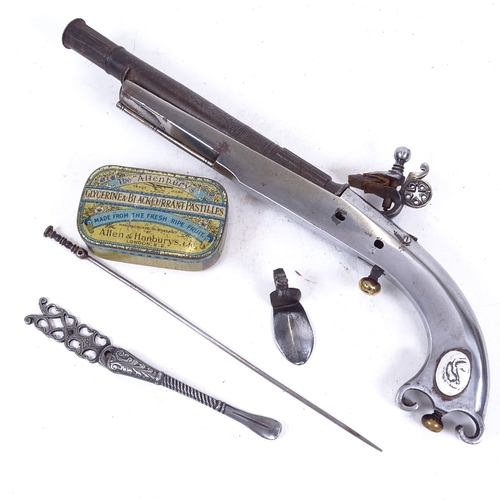 237 - A replica Scottish steel flintlock pistol, engraved barrel, overall length 33cm, dismantled but all ... 