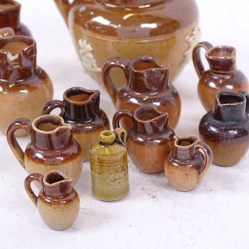 238 - A group of miniature stoneware jugs and ginger beer bottles, including some Royal Doulton (15)