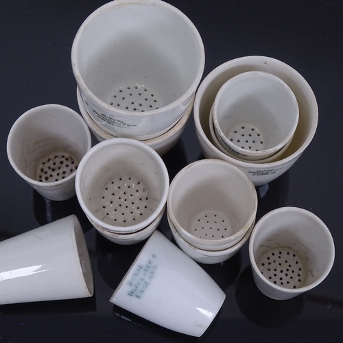 242 - A set of Royal Worcester porcelain beaker shaped strainers, largest height 4.5cm (13)