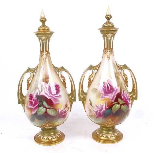 258 - A pair of Royal Worcester ivory porcelain vases and covers, hand painted and gilded floral decoratio... 