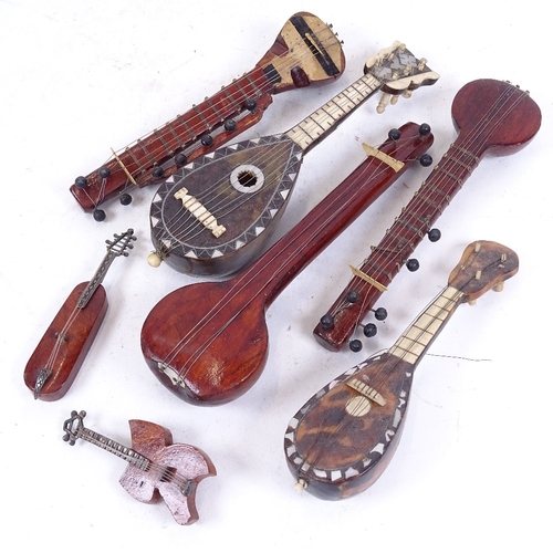 269 - A group of miniature mother-of-pearl tortoiseshell and wood mandolins, largest length 17cm (7)