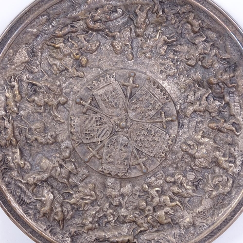 279 - A silver plated Knights of the Round Table Camelot roundel, another relief embossed silver plate on ... 