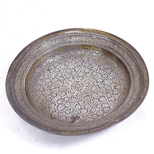 280 - An Eastern unmarked white metal engraved dish, and a white metal-mounted turned wood bowl, largest d... 