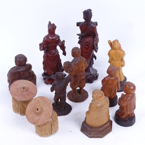 296 - A group of Oriental carved hardwood figures, largest height 18cm (11)