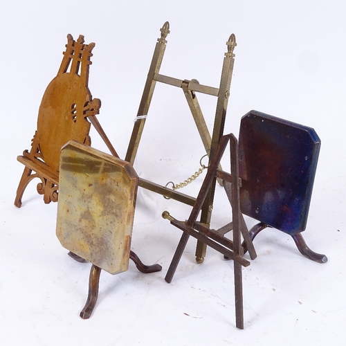 77 - A pair of brass doll's house tilt-top tables, and 3 miniature easels, largest height 16cm (5)